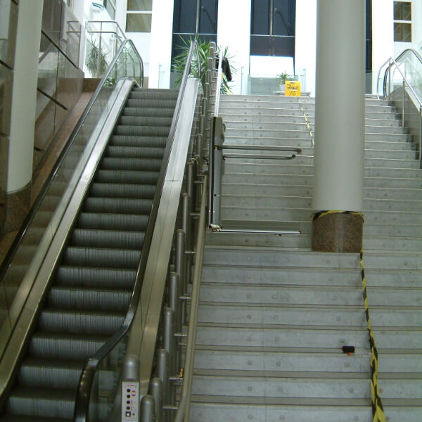 Lift beside escalator